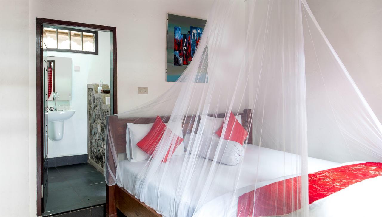 Ecotravel Cottages Bukit Lawang Esterno foto